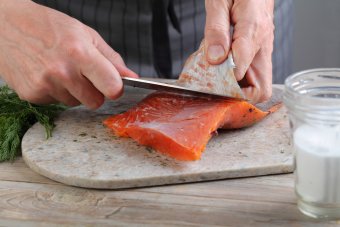 Preparing fish by removing skin